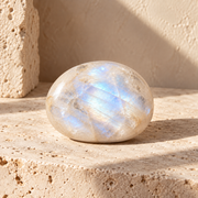 Sensorium Moonstone — Inner Knowing, polished moonstone on warm travertine